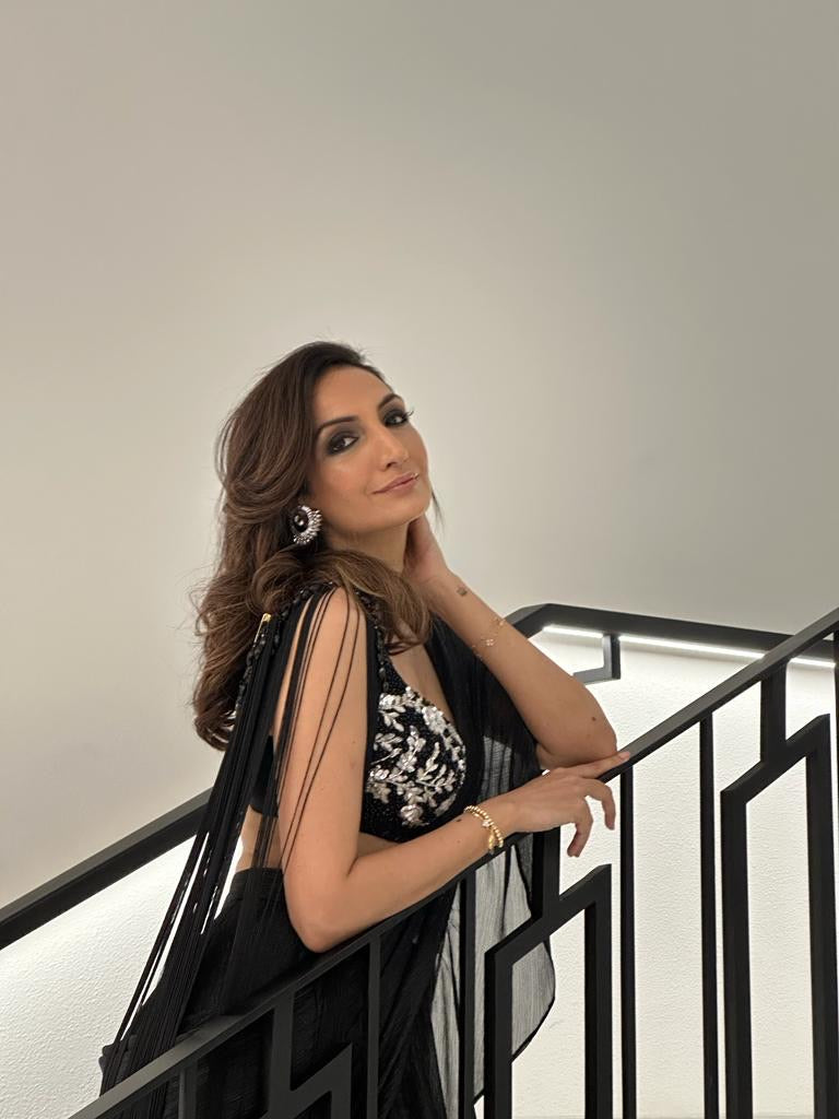 Black ruffled metallic saree paired